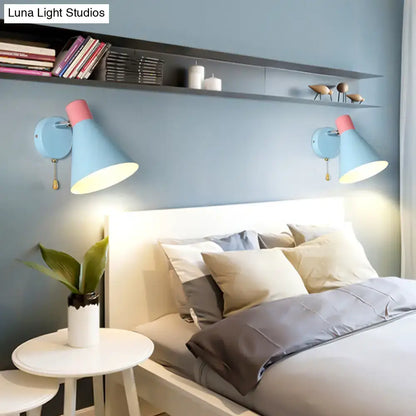 Contemporary blue metal direct wired bedroom sconce with pink accents matte finish adjustable arms e26 e27 pull chain