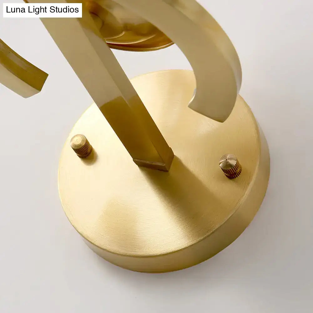 Contemporary brass wall lamp with clear crystal accents and gold-toned curved arms for bedroom sconce e12 e14