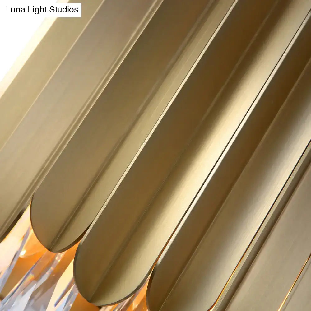 Contemporary wall lamp with brass finish and golden metallic elongated slats for living room sconce lighting