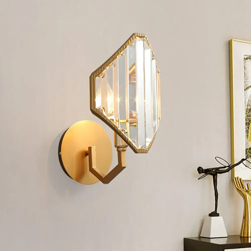 Contemporary brass rhombus wall sconce with gold finish and clear crystal prism shade for bedroom lighting