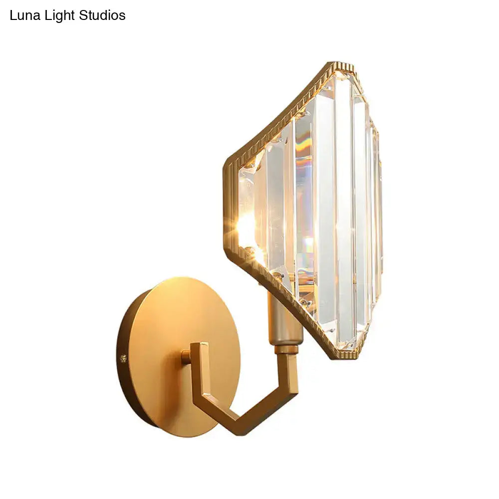 Contemporary brass rhombus wall sconce with gold finish and clear crystal prism shade for bedroom lighting