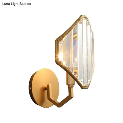 Contemporary brass rhombus wall sconce with gold finish and clear crystal prism shade for bedroom lighting