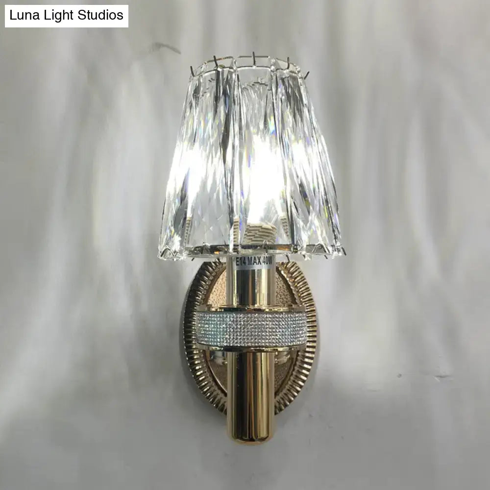 Contemporary bronze crystal wall sconce light with crystal-encrusted gold-toned tiered faceted glass shade
