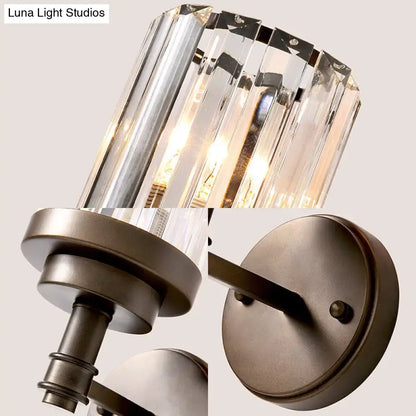 Contemporary bronze wall sconce with clear crystal prism ribbed crystal shade and dark bronze metal base light fixture