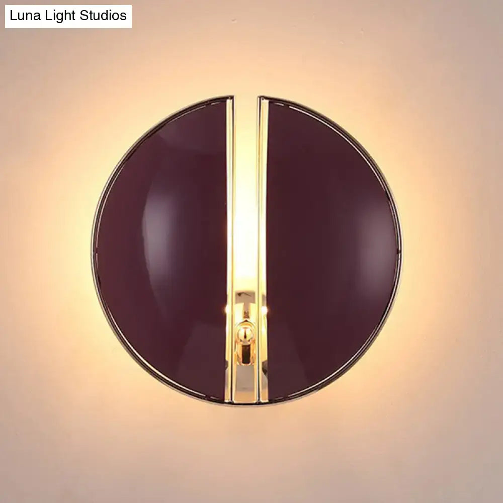 Contemporary burgundy and gold wall lamp with a sleek circular design and central gold-toned light strip