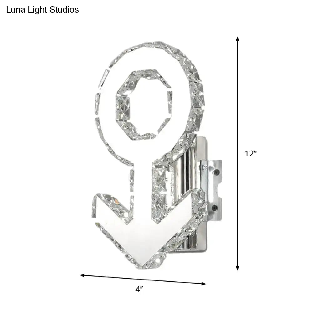 Contemporary chrome wall lamp with crystal-encrusted anchor design and warm white light, featuring sleek fixture height