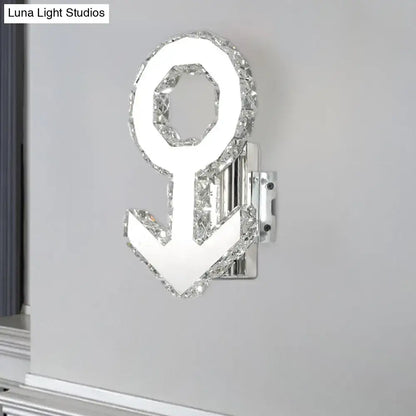 Contemporary wall lamp with warm white light, chrome anchor fixture, crystal outline, and sleek modern design height