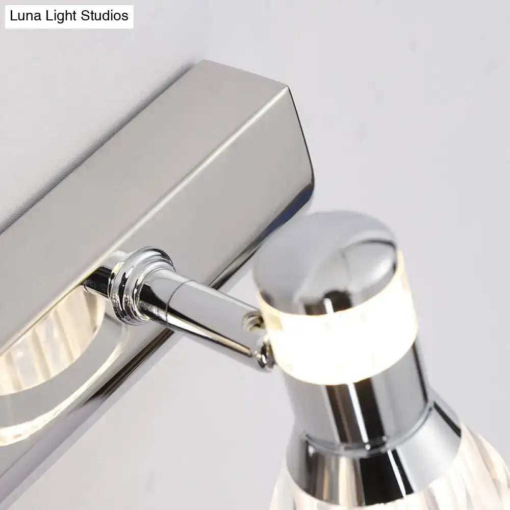 Contemporary style conic sconce light in chrome finish with adjustable wall mount and faceted crystal diffuser for bathroom vanity