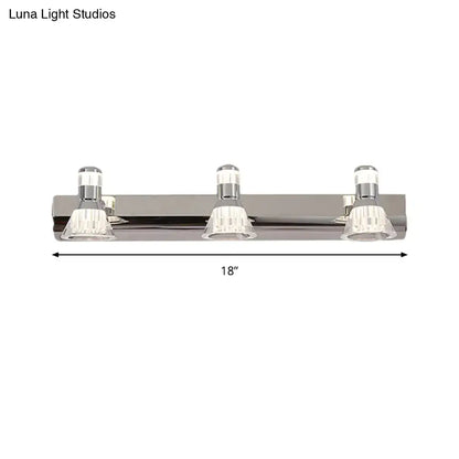 Silver chrome finished three-light contemporary style conic sconce light with clear crystal shades for bathroom vanity lighting