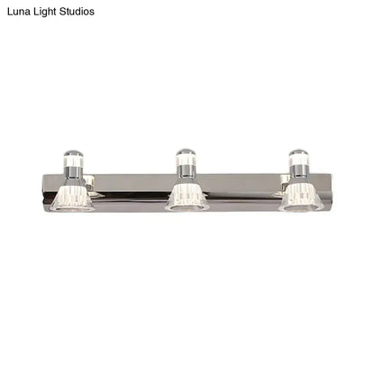 Contemporary style chrome conic sconce light with three clear crystal accents for bathroom vanity lighting
