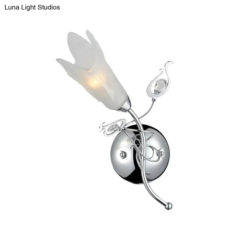 Contemporary chrome e12 wall sconce with frosted opal glass petal shade and crystal accents for bedroom lighting