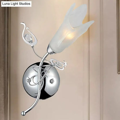 Contemporary chrome e12 wall sconce with frosted opal glass tulip shade and crystal accents for bedroom lighting