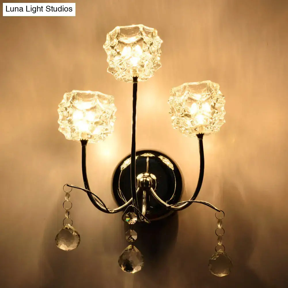 Elegant contemporary chrome wall sconce with three faceted crystal shades and dangling teardrop crystals fixture height visible