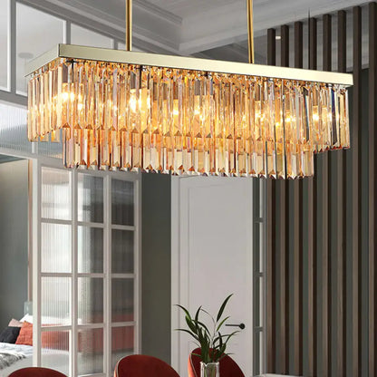 Gold-toned rectangular dining room chandelier with cascading clear amber crystal prisms light fixture