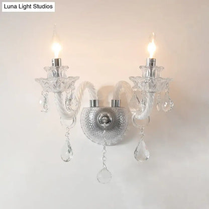 Contemporary crystal chandelier wall sconce with clear faceted crystals and polished chrome for living room lighting