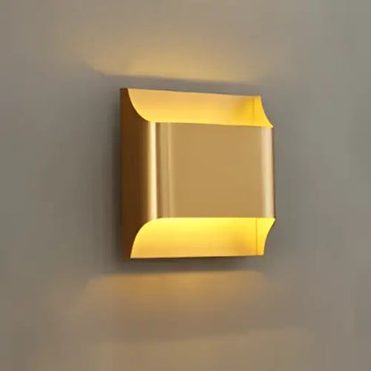 Gold-colored contemporary copper brass wall sconce by decorbites with a sleek modern design for living room decor