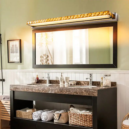 Contemporary crystal gold wall sconce with warm white led light and sleek gold-accented rectangular metallic frame