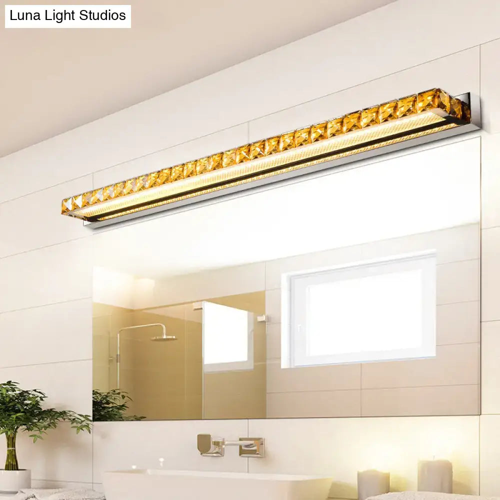 Contemporary crystal gold wall sconce with warm white led light and gold-accented rectangular mirror frame