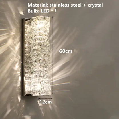 A sleek 60cm tall decorbites contemporary crystal wall sconce with stacked crystal segments and gold frame