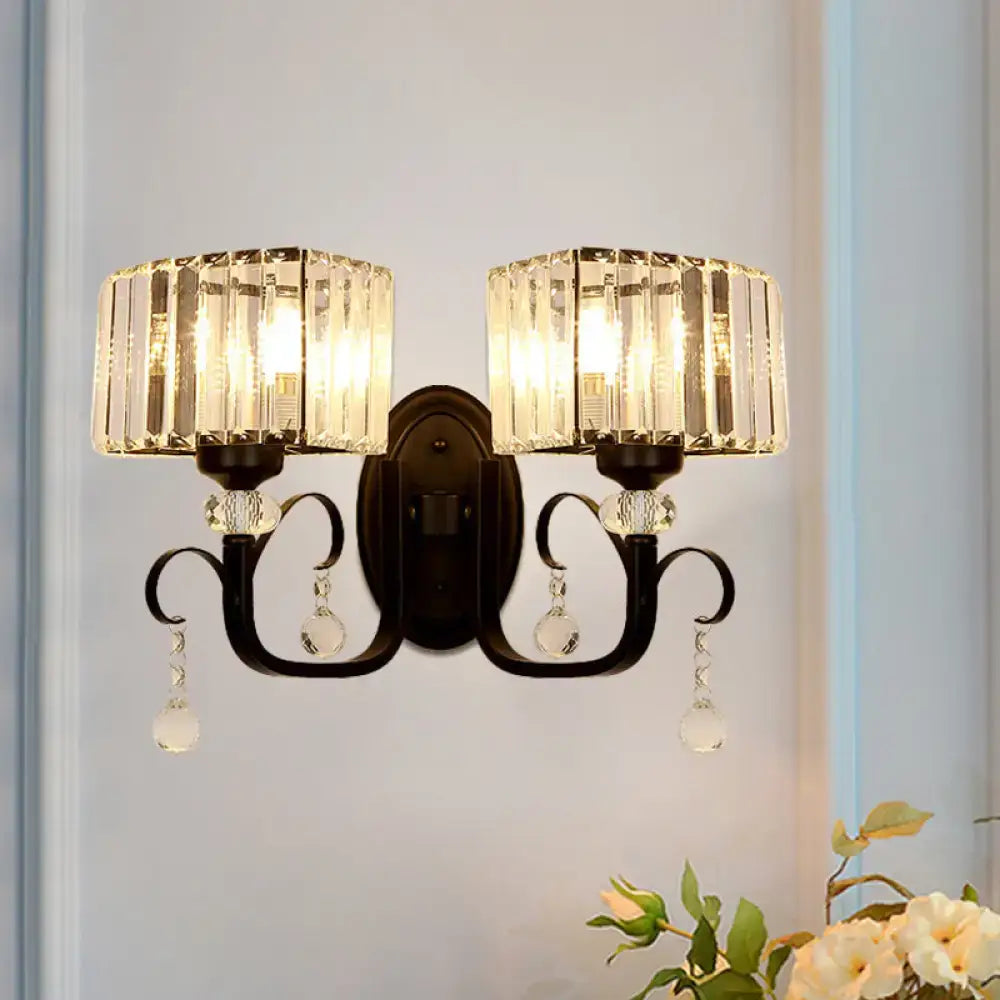 Elegant black wrought iron metal wall sconce with two crystal-framed fixtures and clear glass beads for a bedroom wall lamp