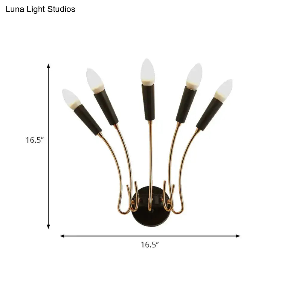 Contemporary metal sconce with five curved brass arms and matte black cylindrical led bulb sleeves for living room use