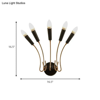 Contemporary metal sconce with five curved brass arms and matte black cylindrical led bulb sleeves for living room use