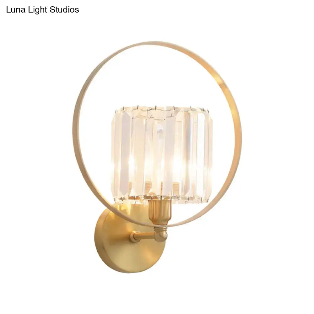 Contemporary gold and crystal wall light featuring a gold-toned circular wall lamp with cylindrical crystal shade 220v-240v 110v-120v