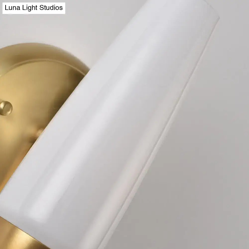 Contemporary gold and opal conical wall sconce with white frosted glass lampshade and gold metal base for bedroom light