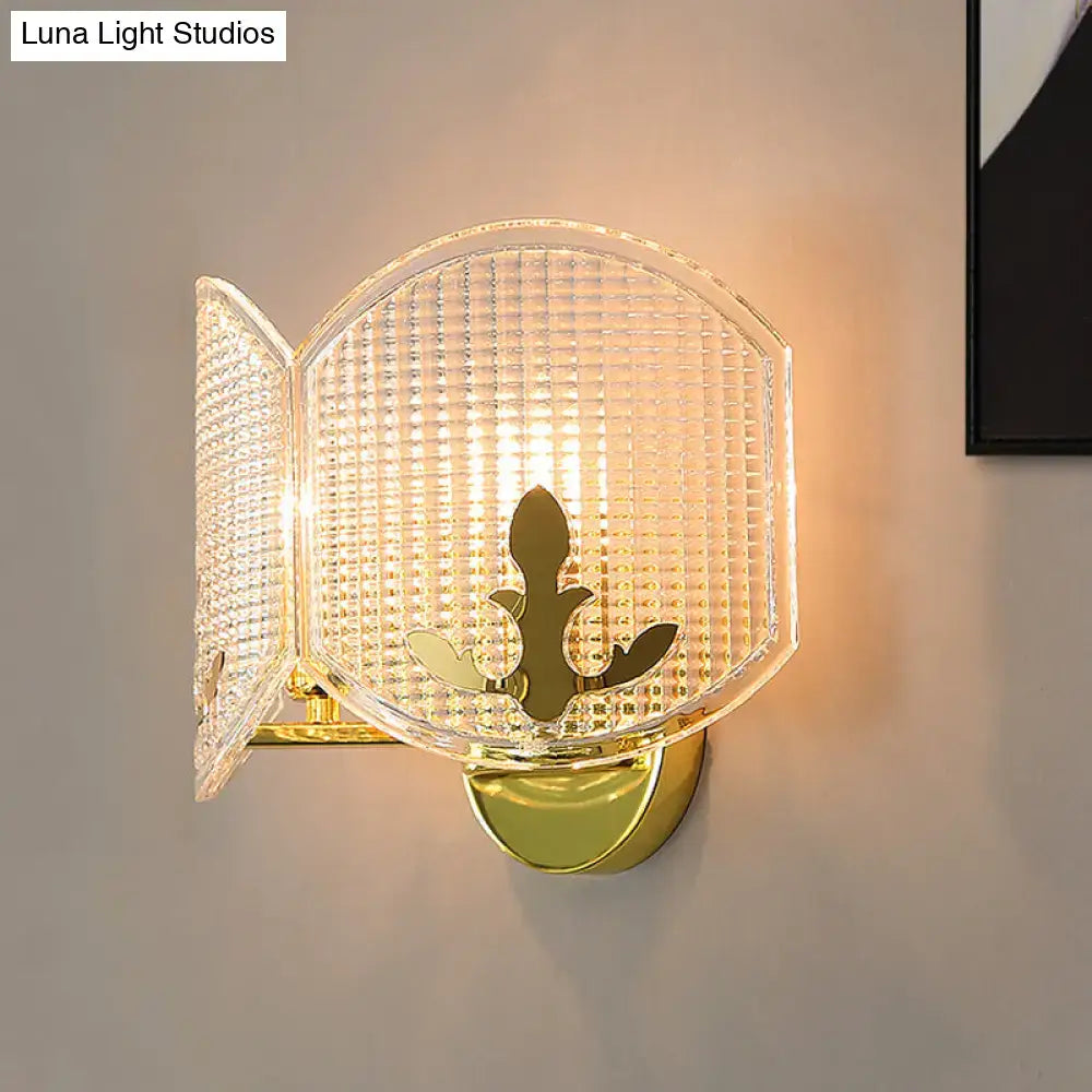 Contemporary gold arc light fixture wall sconce with textured translucent glass shade and ornate leaf motif