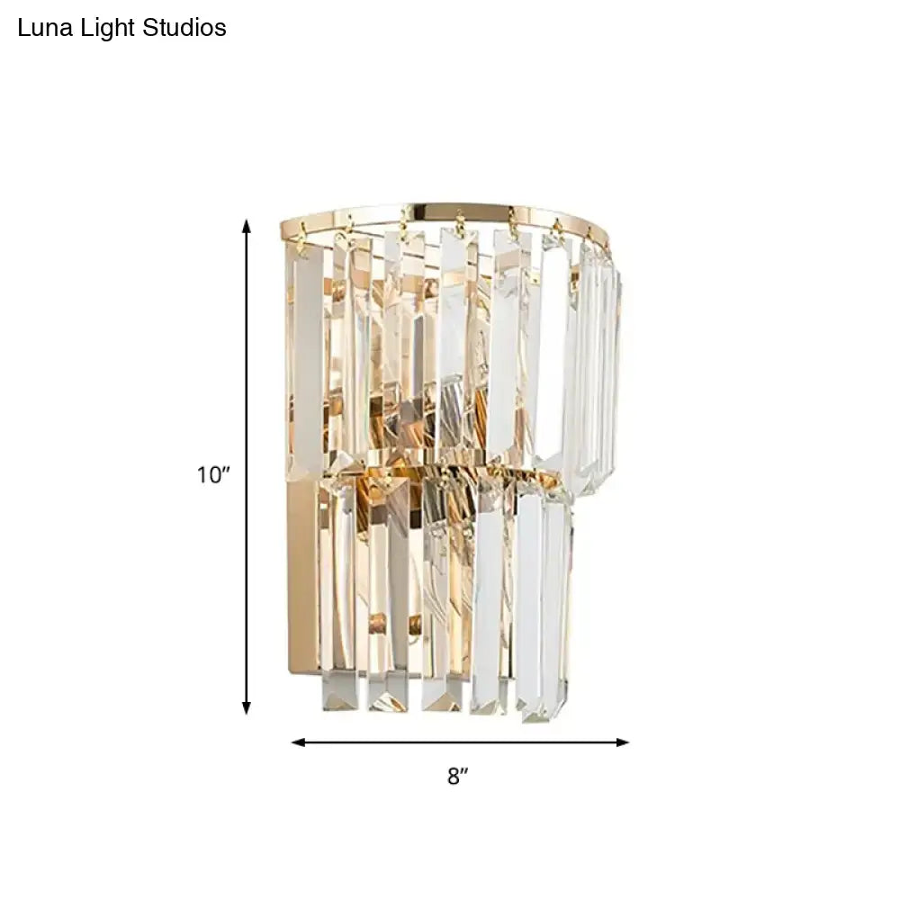 Contemporary gold wall lamp with cascading clear crystal block prisms for dining room illumination