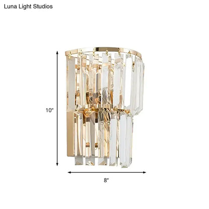 Contemporary gold wall lamp with cascading clear crystal block prisms for dining room illumination