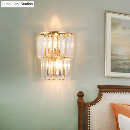 Contemporary two-tiered gold crystal block wall lamp with faceted glass for elegant dining room lighting