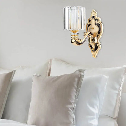 Contemporary gold crystal cylinder wall sconce light with ornate gold-toned fixture and faceted crystal shade for e26 e27 bulbs