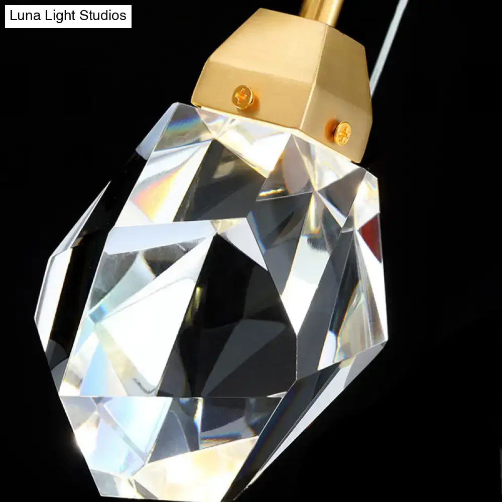 Faceted crystal stone-shape pendant light fixture with gold-toned metal cap in a contemporary style down lighting pendant