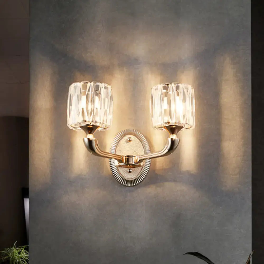 Brass-finished contemporary wall lamp with two faceted crystal shades suitable for led incandescent fluorescent light type