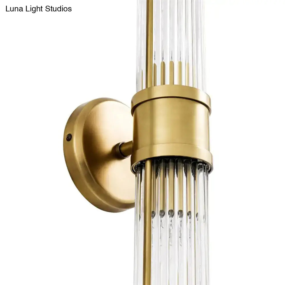 Contemporary gold crystal wall sconce light fixture with vertical clear glass rods for living room lighting