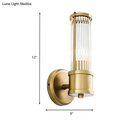 Contemporary gold crystal wall sconce light fixture with vertical rods and cylindrical glass shade for living room