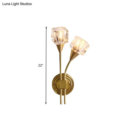 Brass-finished contemporary gold cube wall sconce with two clear crystal faceted shades for 110v-120v use