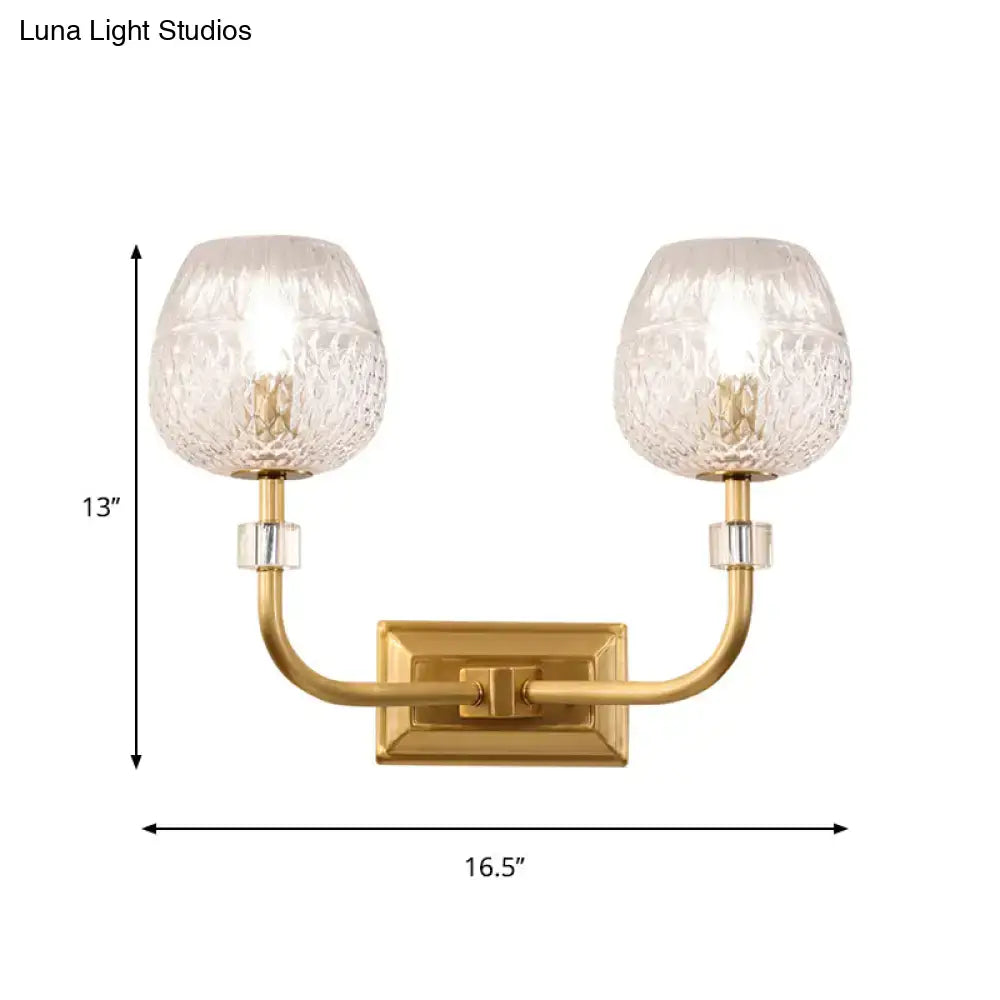 Contemporary gold dome foyer wall light with clear lattice glass globes and gold-toned rectangular mounting plate