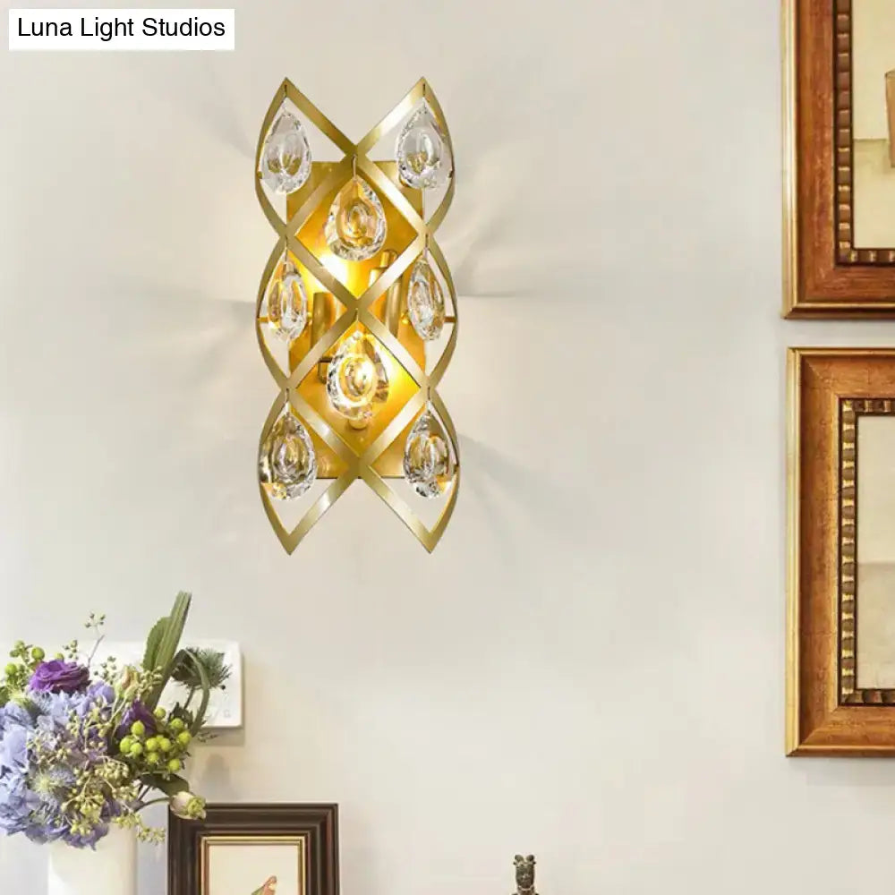 Contemporary gold geometric teardrop sconce light fixture with clear crystal accents for living room lighting