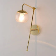 Contemporary gold gooseneck sconce light with spherical glass shade and wall mount lamp for bedroom use