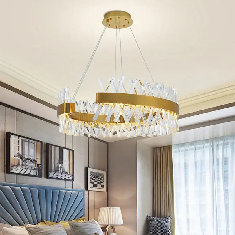 Contemporary gold led crystal chandelier with a circular metal frame and clear crystal accents for living room decorbites contemporary led design