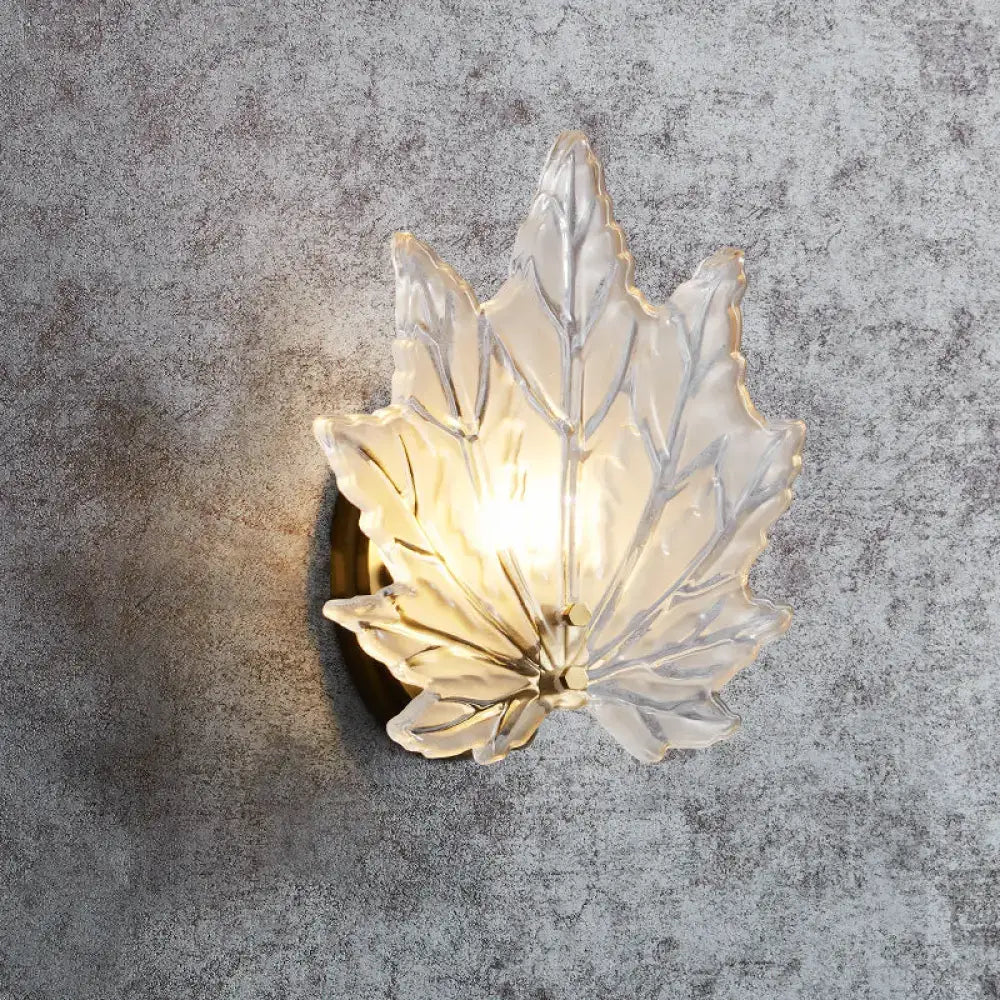 Contemporary gold maple leaf bedroom wall light with translucent frosted glass and warm crystal glow sconce