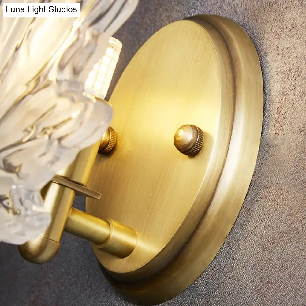 Contemporary brass-finished wall light with clear crystal maple leaf accents for maple leaf bedroom decor