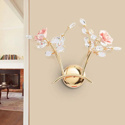 Contemporary gold wall lamp with pink rose crystal branches and clear leaves bulb included for bedroom sconce use