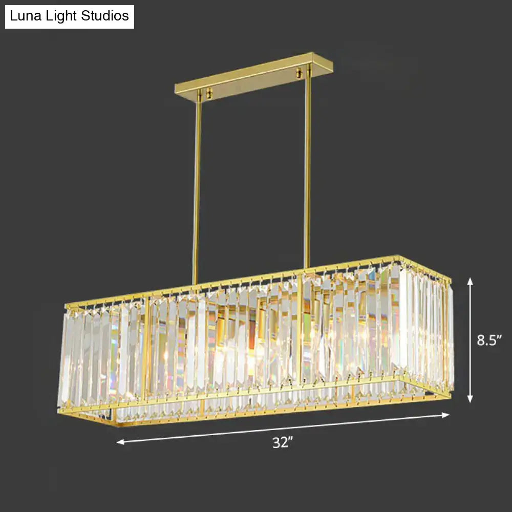 Contemporary gold rectangular island pendant light with clear tri-prism crystal accents for dining room ceiling
