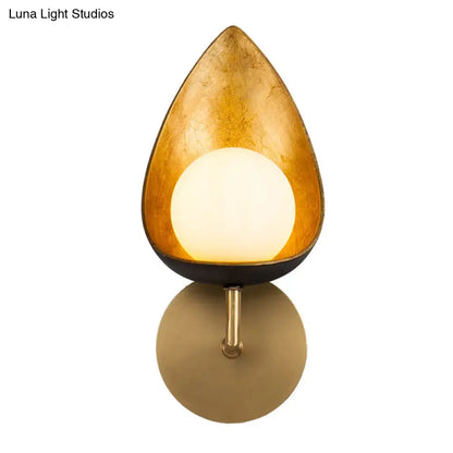 Contemporary gold teardrop sconce light with frosted glass and matte black base for bedroom wall mounting