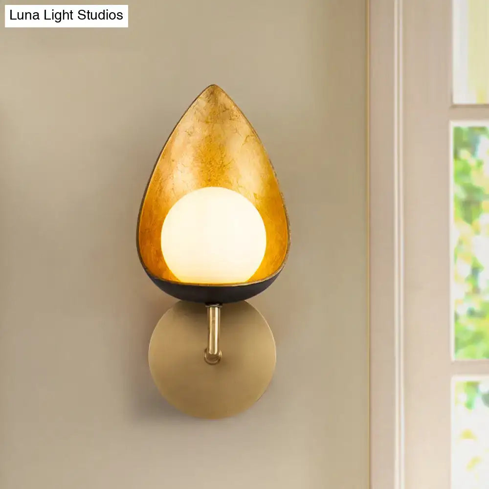 Contemporary gold teardrop sconce light with frosted glass and matte black base for bedroom wall mounting
