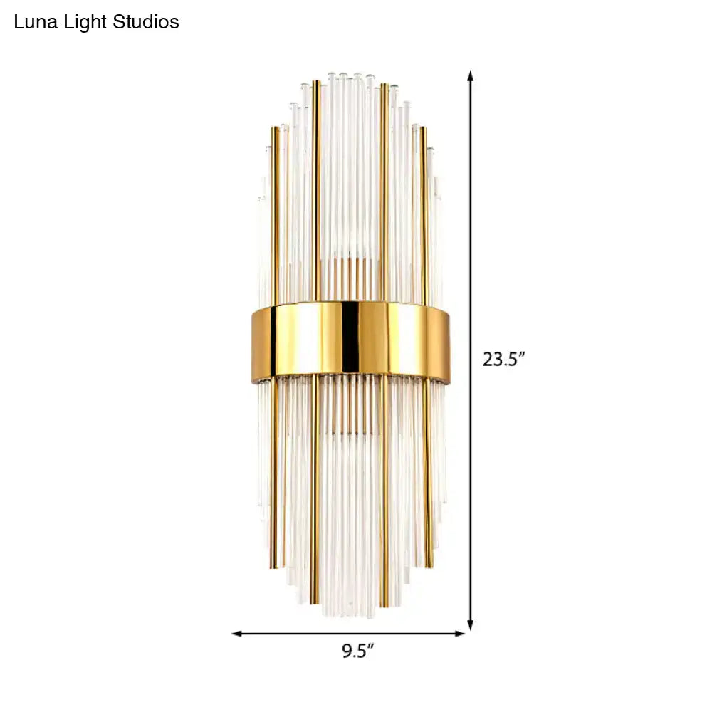 Contemporary gold wall light with clear crystal shade featuring gold-toned brass and radiating clear glass rods for living room