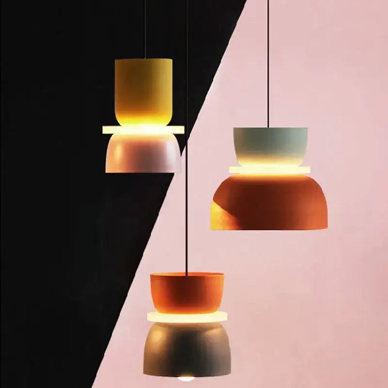Three modern pendant lamps with stacked bowl-shaped shades in yellow greenish-blue and orange-brown by decorbites contemporary led lustre